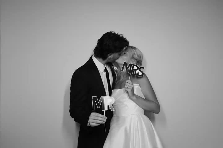 Guests filming a boomerang in the photobooth at a Barrie wedding